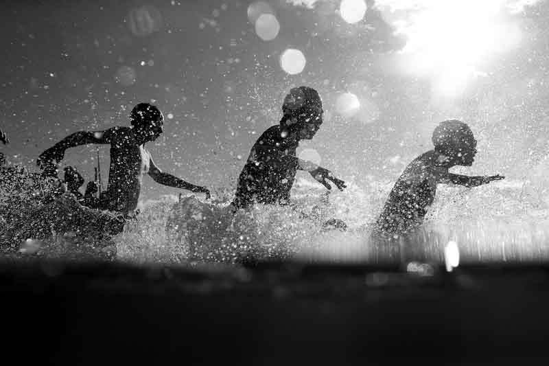 SUNSHINE COAST, AUSTRALIA - SEPTEMBER 03:  (EDITORS NOTE: This image has been converted to Black and White) Ironkids kids compete during Ironman 70.3 World Championship on September 3, 2016 in Sunshine Coast, Australia.  (Photo by Chris Hyde/Getty Images)